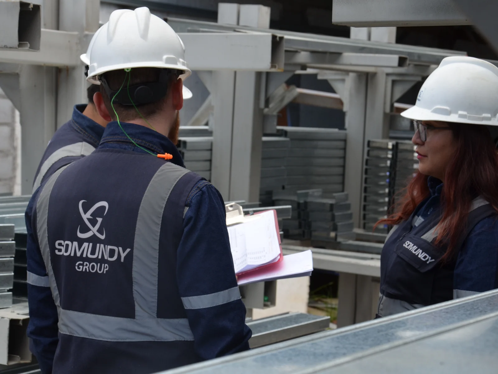 SOMUNDY engineers reviewing a project at the plant.